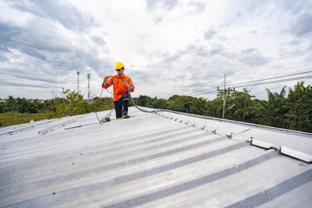 a skilled technician adjusts a solar panel on roof 2026 01 09 11 58 19 utc Large