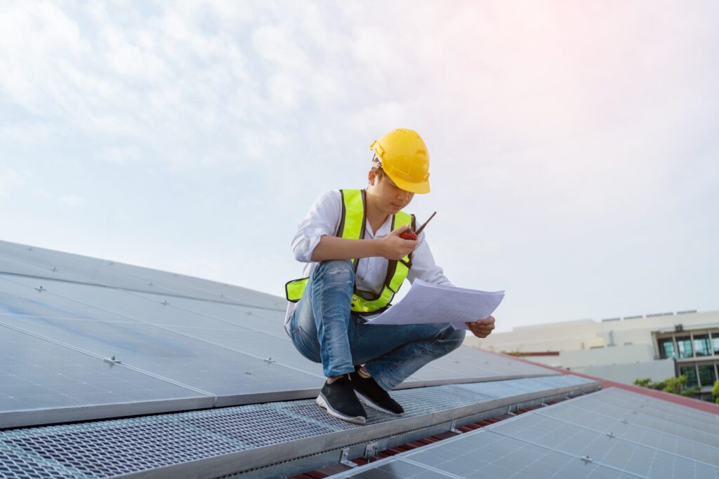 men technicians carrying photovoltaic solar moduls 2026 01 09 07 42 02 utc Large